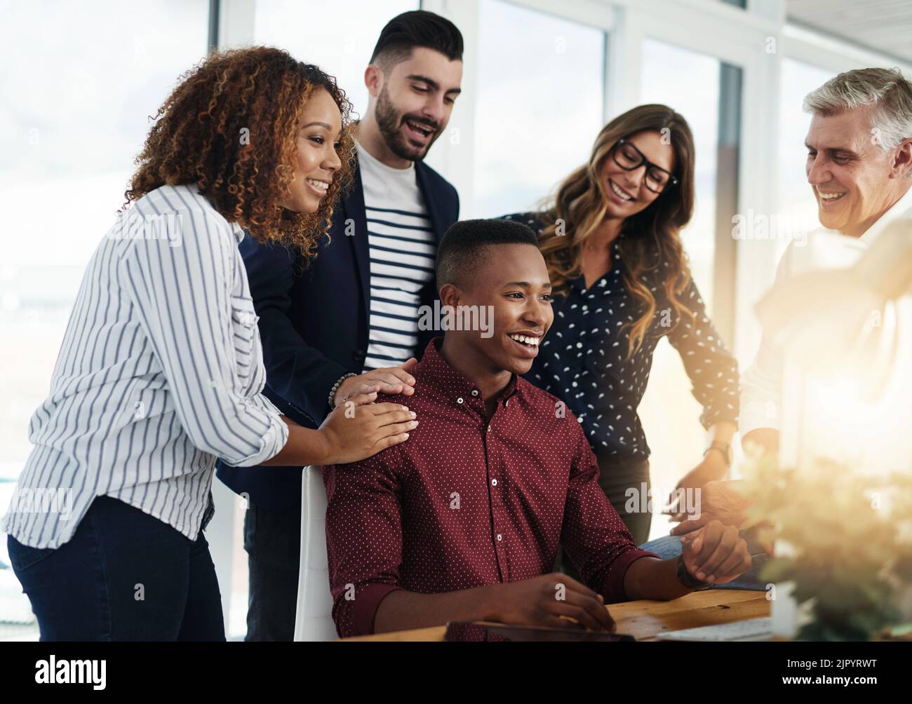 He made his team proud. a group of designers working together. Stock Photo