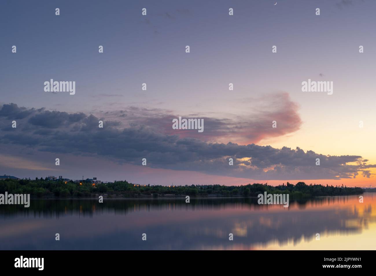 A beautiful sunset reflecting on the water Stock Photo - Alamy