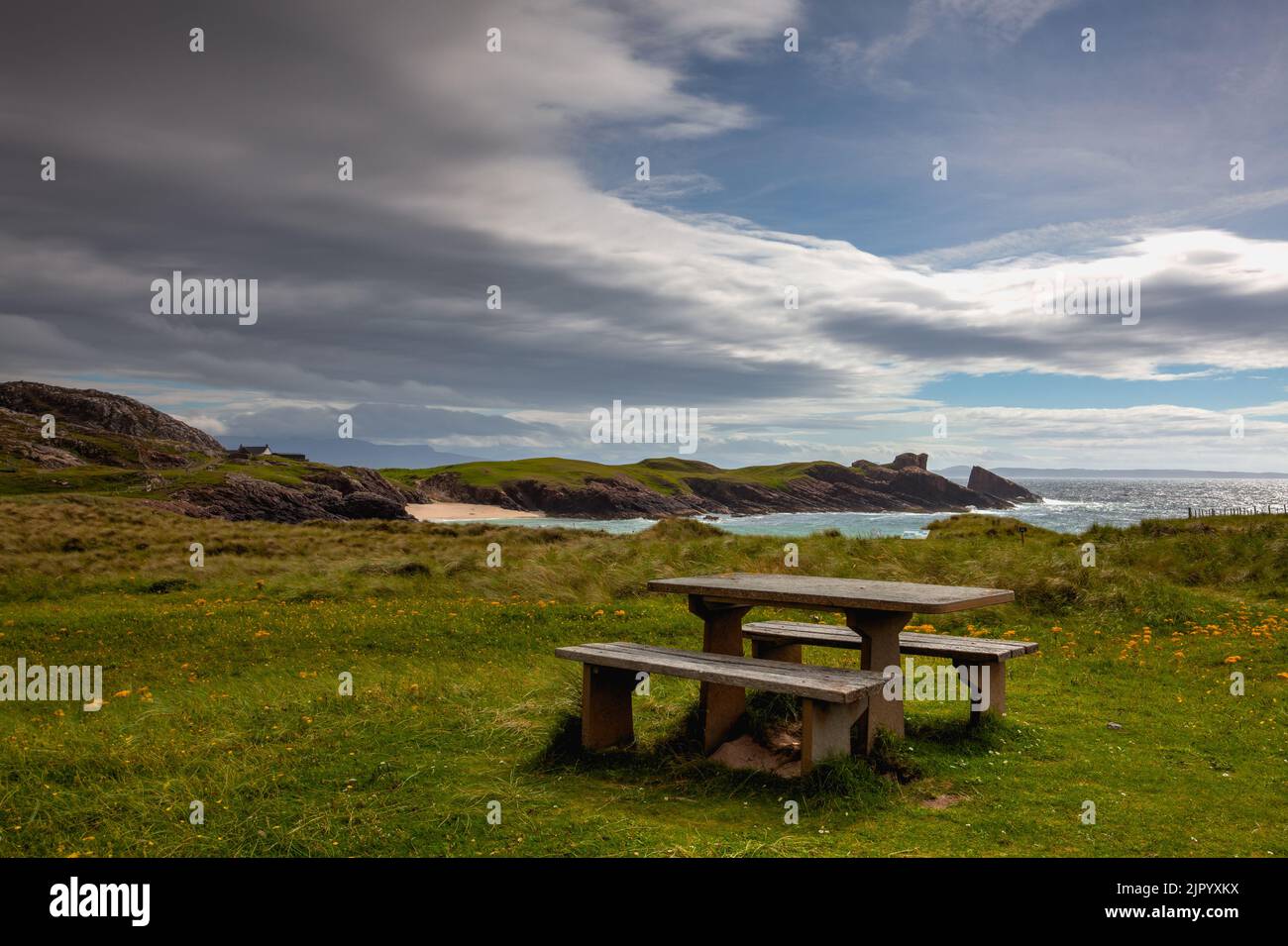 Amazing Clachtoll Beach in Lochinver, Scotland. Clachtoll Beach is a popular beach with some rugged terrain, including the Split Rocks Stock Photo
