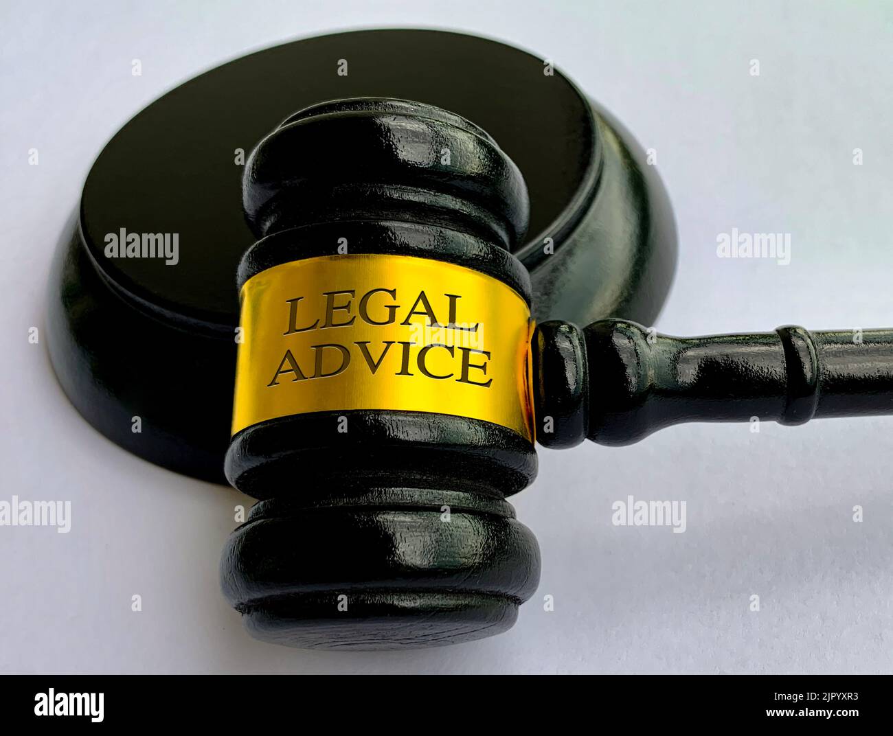 Legal advice text engraved on lawyer gavel on white cover background. Legal and law concept. Stock Photo