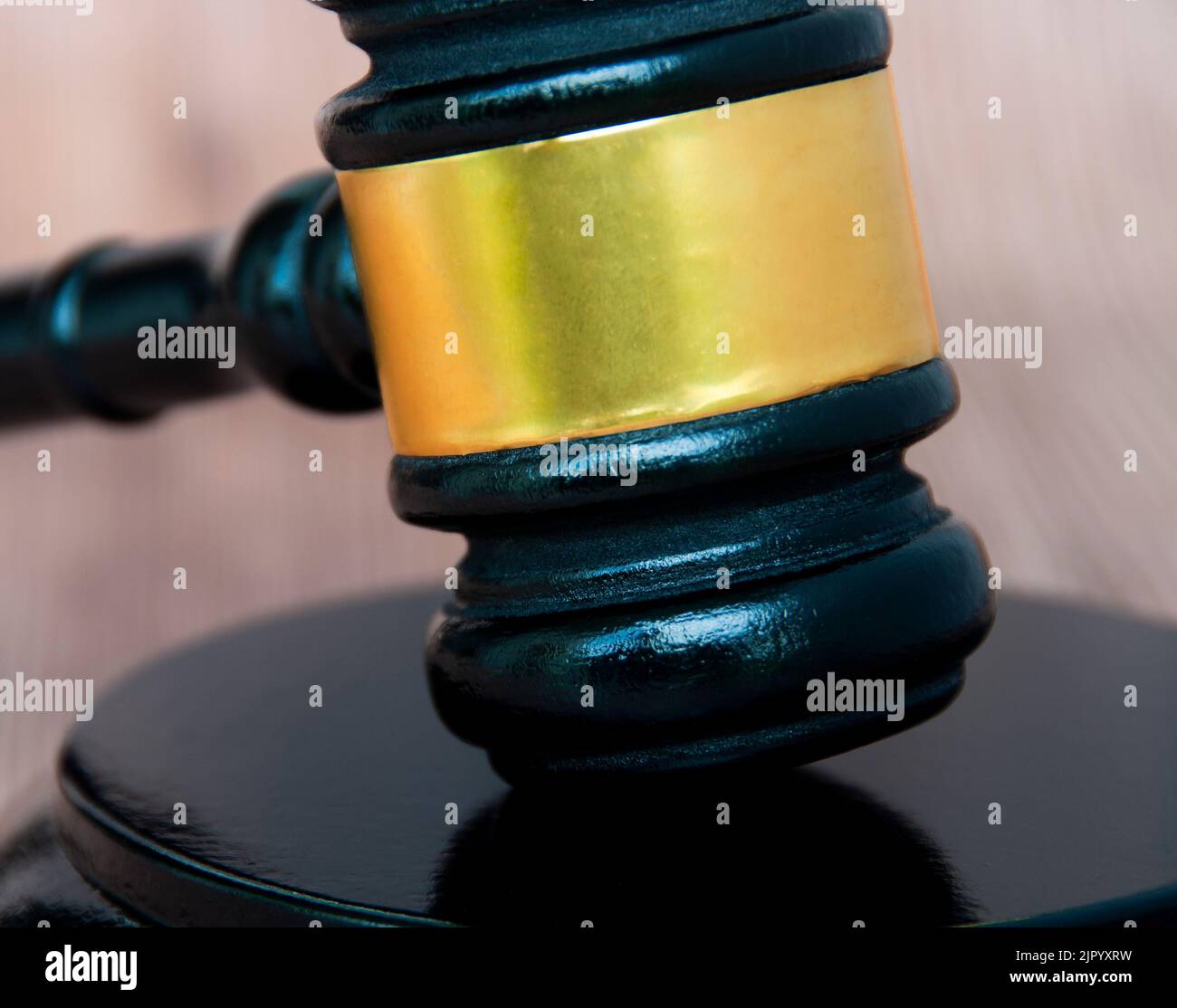 Close up of gavel on wooden table. Copy space and law concept. Stock Photo