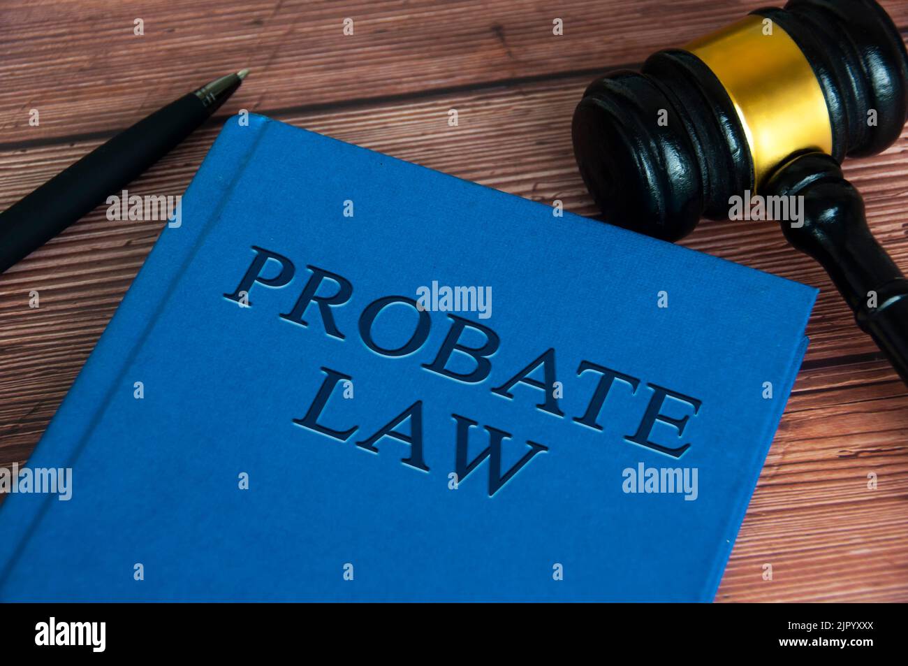 Probate law book with gavel and pen on wooden table. Law concept. Stock Photo