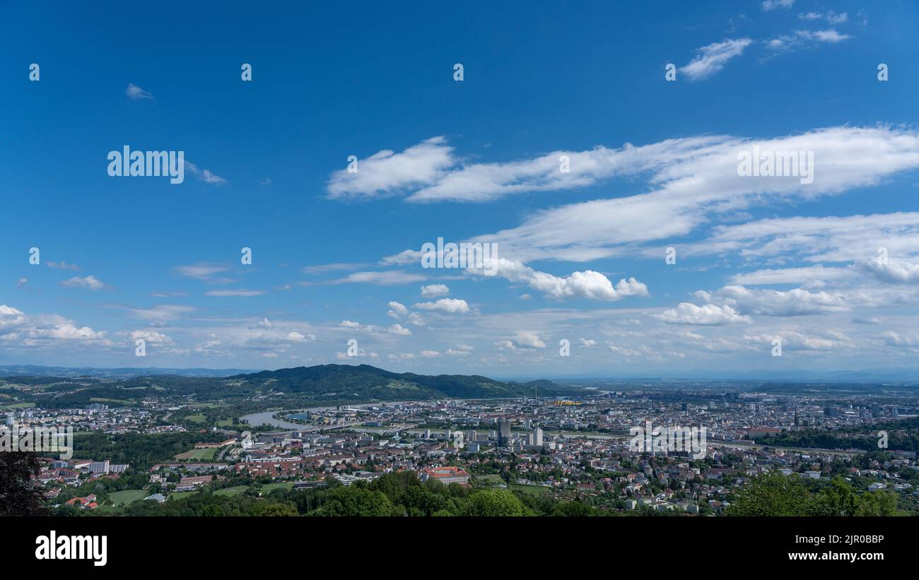 Scenic blue sky over Linz city and Postlingberg on the left bank of the ...