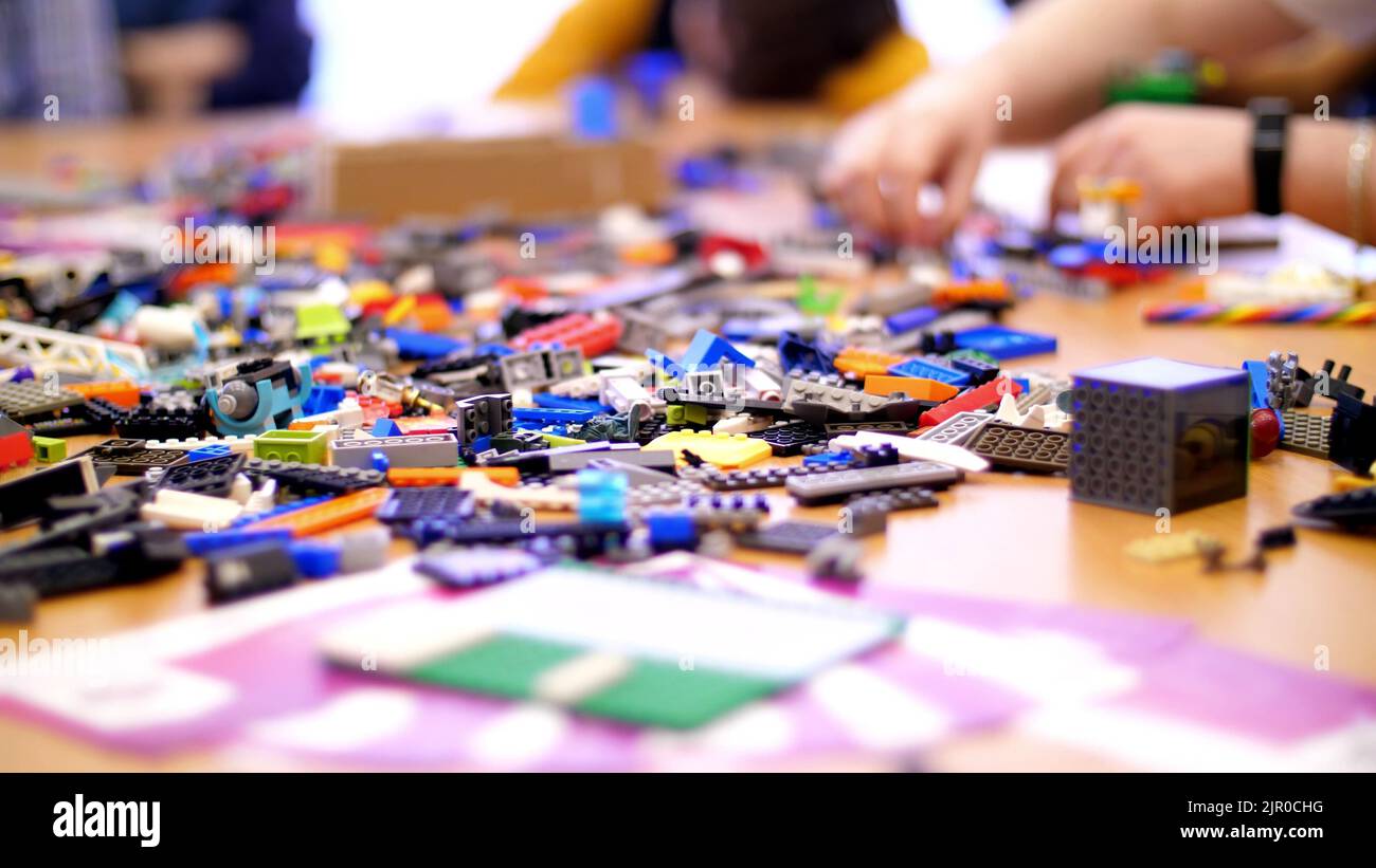 on the table there are scattered a lot of details from the children's ...