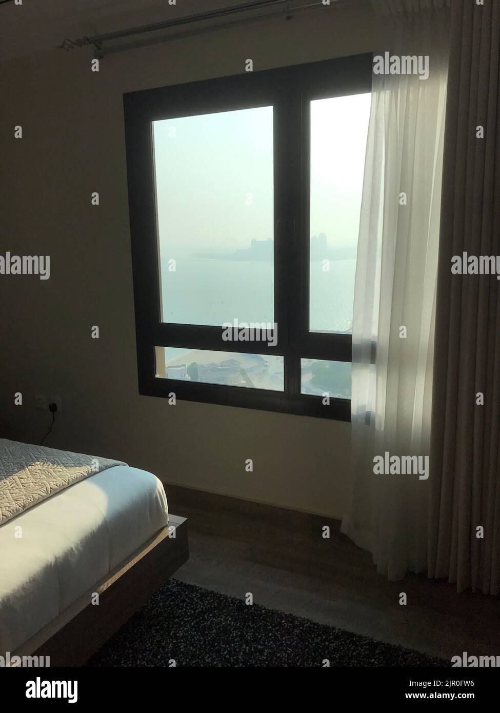 hotel window overlooking coastal bay doha qatar Stock Photo Alamy