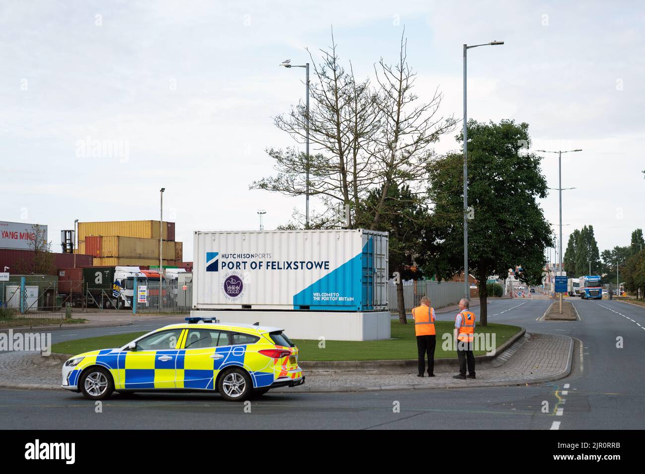 Police Container Terminal A police car and security personnel at one of the entrances to the Port ...