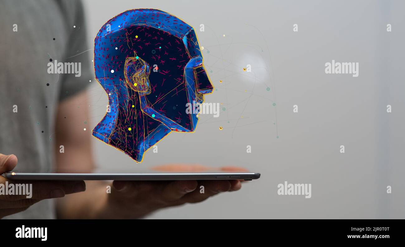 A blue digital human head floating on a tablet - artificial intelligence and creativity concept Stock Photo
