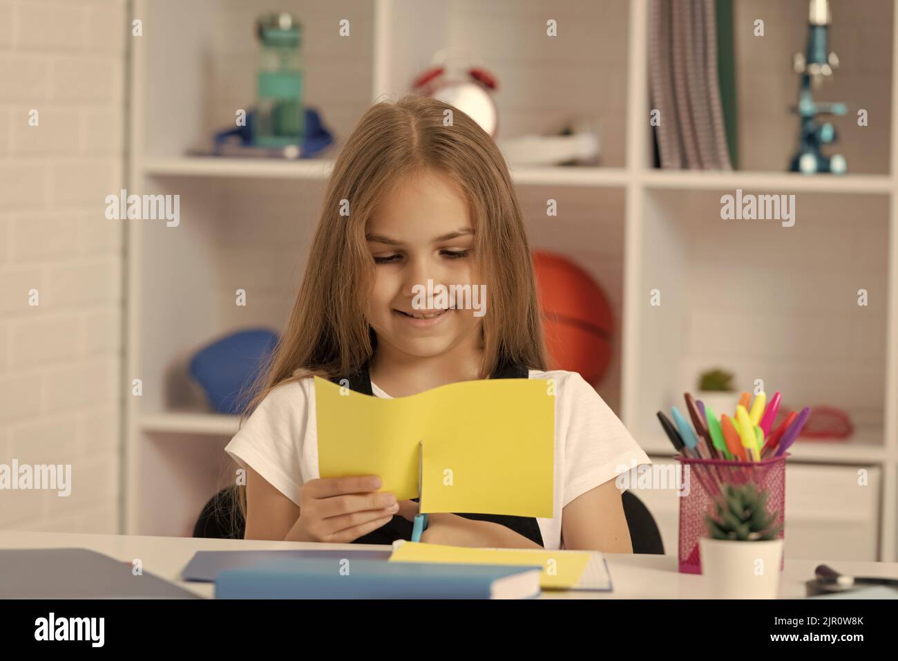 child smile and cut paper in school classroom Stock Photo - Alamy