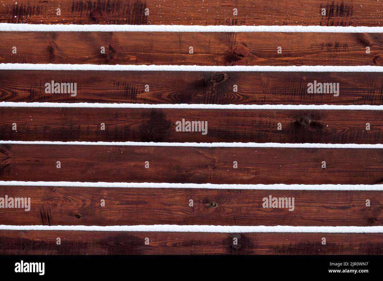 Wooden fence background with snow lying on the boards Stock Photo - Alamy