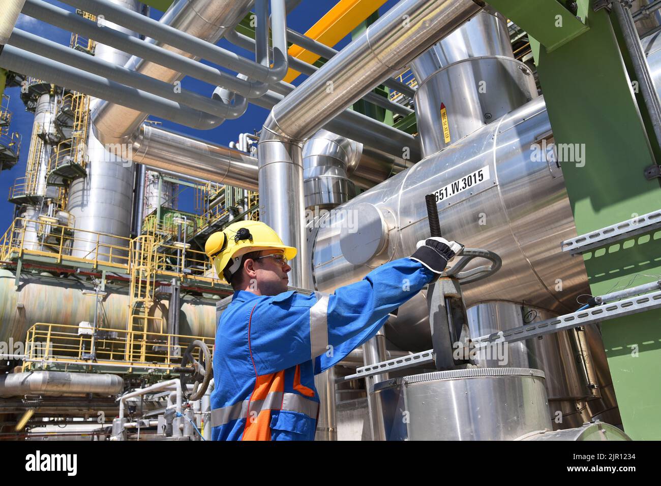 workers in an industrial plant for the production and processing of crude oil Stock Photo
