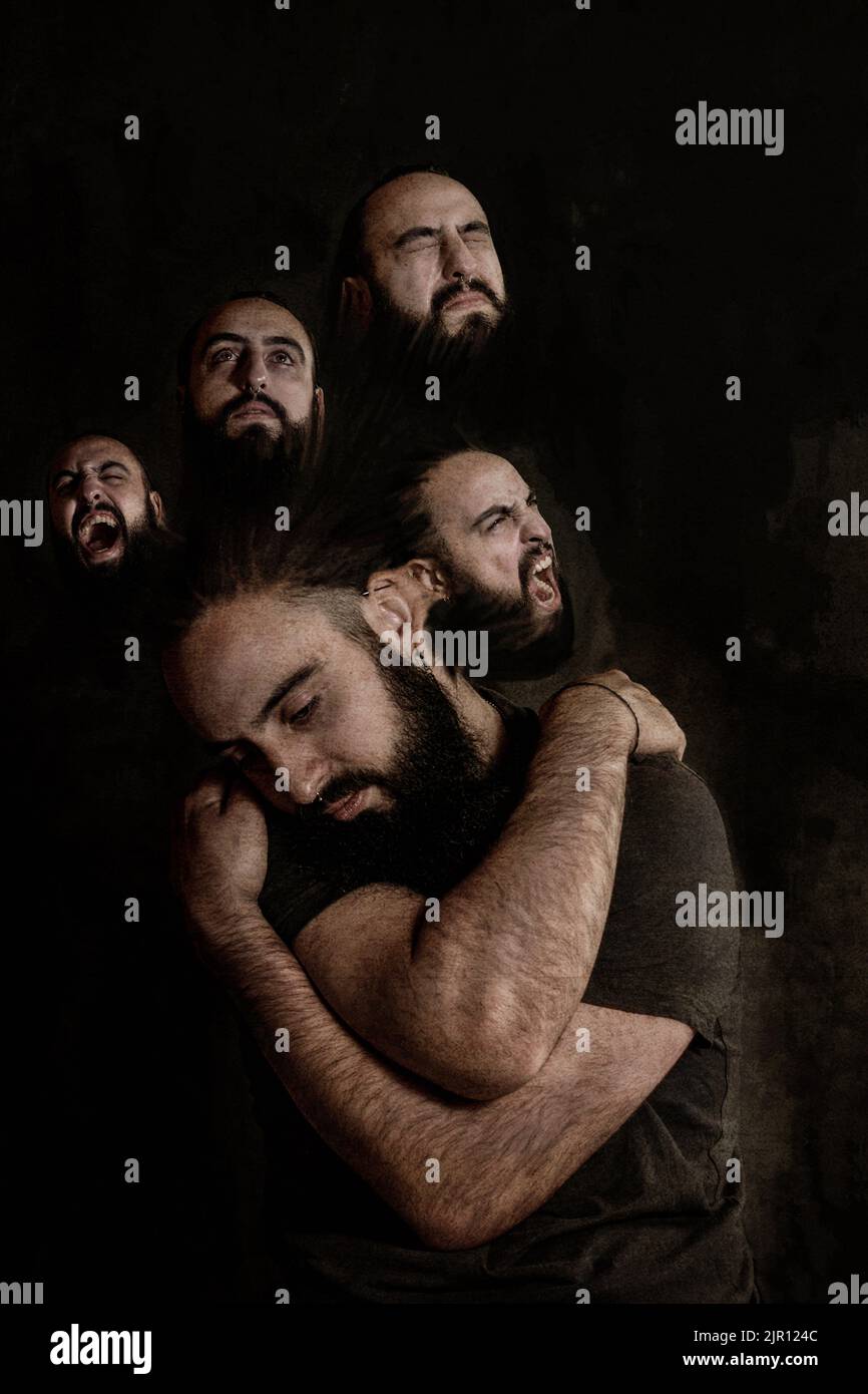 Mental Health Aftercare, man trying to be good with all his moods. convalescent man trying to go ahead with his sadness. Feelings going out of head Stock Photo