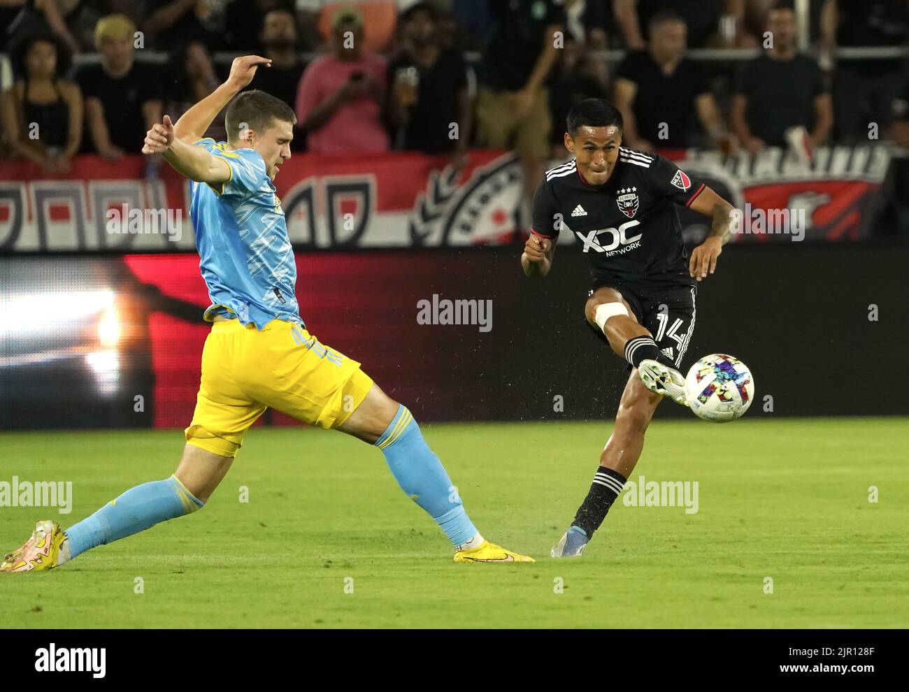 WASHINGTON, DC, USA - 20 AUGUST 2022: D.C. United midfielder Andy Najar (14) shoots past Philadelphia Union forward Mikael Uhre (7) during a MLS match between D.C United and the Philadelphia Union on August 20, 2022, at Audi Field, in Washington, DC. (Photo by Tony Quinn-Alamy Live News) Stock Photo