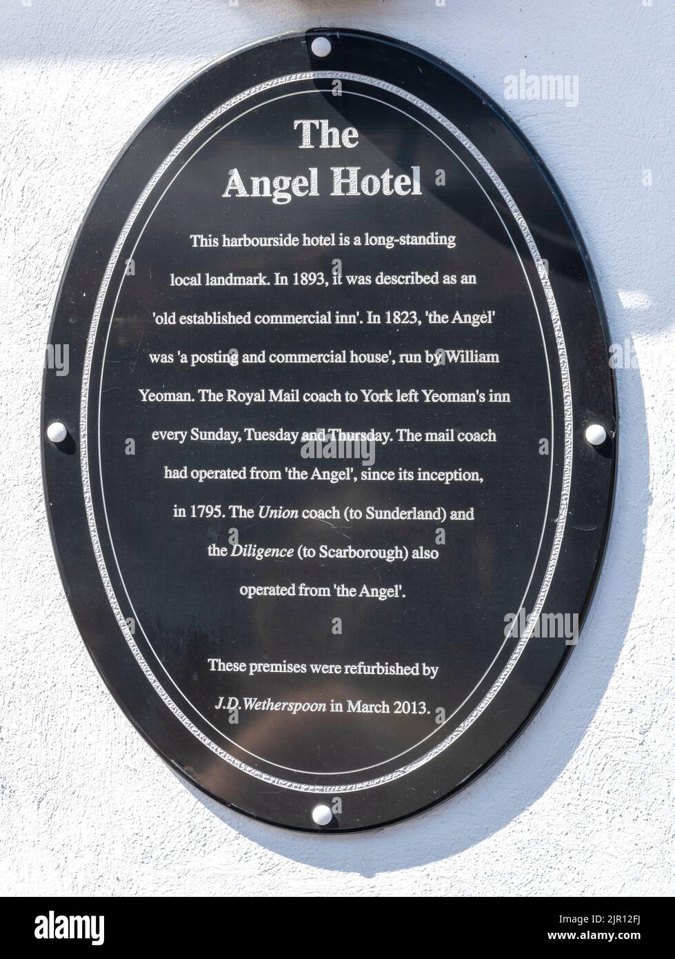 Heritage plaque at The Angel Hotel - Wetherspoon public house - New Quay Road, Whitby, North Yorkshire, Yorkshire, England, UK Stock Photo