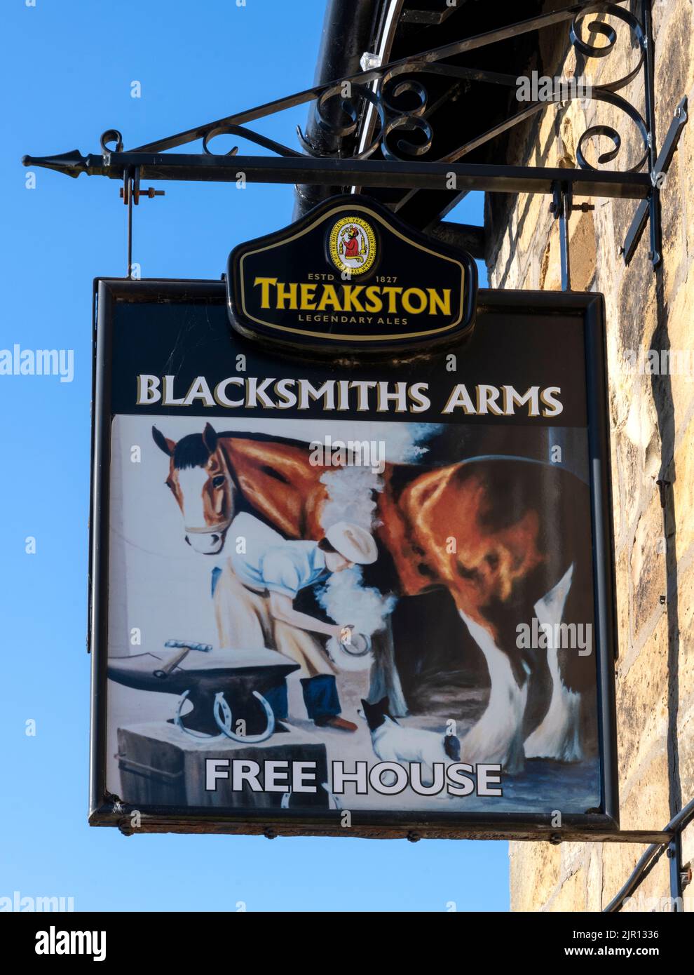 Traditional hanging pub sign at the Blacksmiths Arms Inn - public house - High Street, Cloughton, Scarborough, North Yorkshire, England, UK Stock Photo