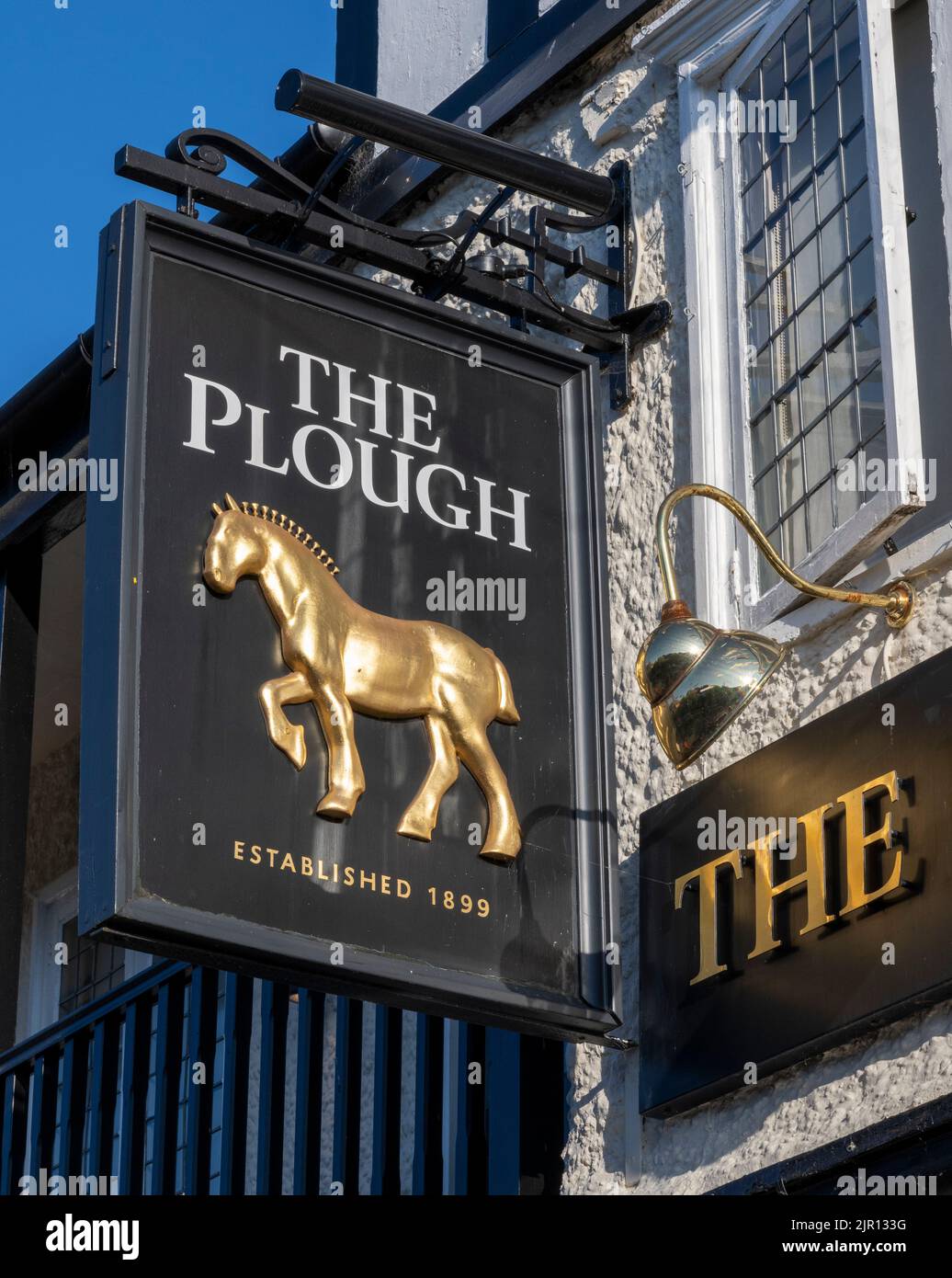 Traditional hanging pub sign at The Plough public house, High Street, Scalby, Scarborough, North Yorkshire, England, UK Stock Photo