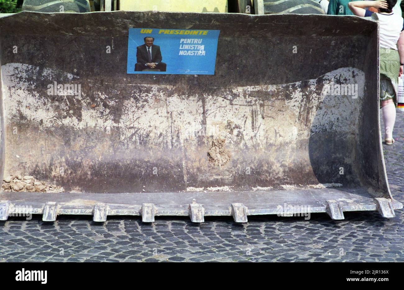 May, 1990. The first democratic elections after the fall of communism. Political poster of candidate (later president) Ion Iliescu placed in a bulldozer's blade. Stock Photo