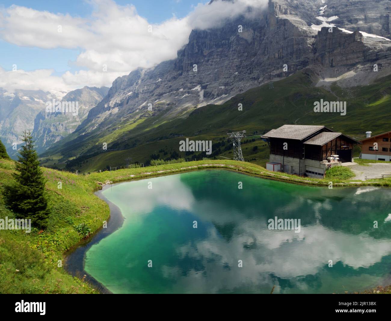 A reservoir beneath the Eiger north face near Kleine Scheidegg, Bernese Oberland, Switzerland. Stock Photo