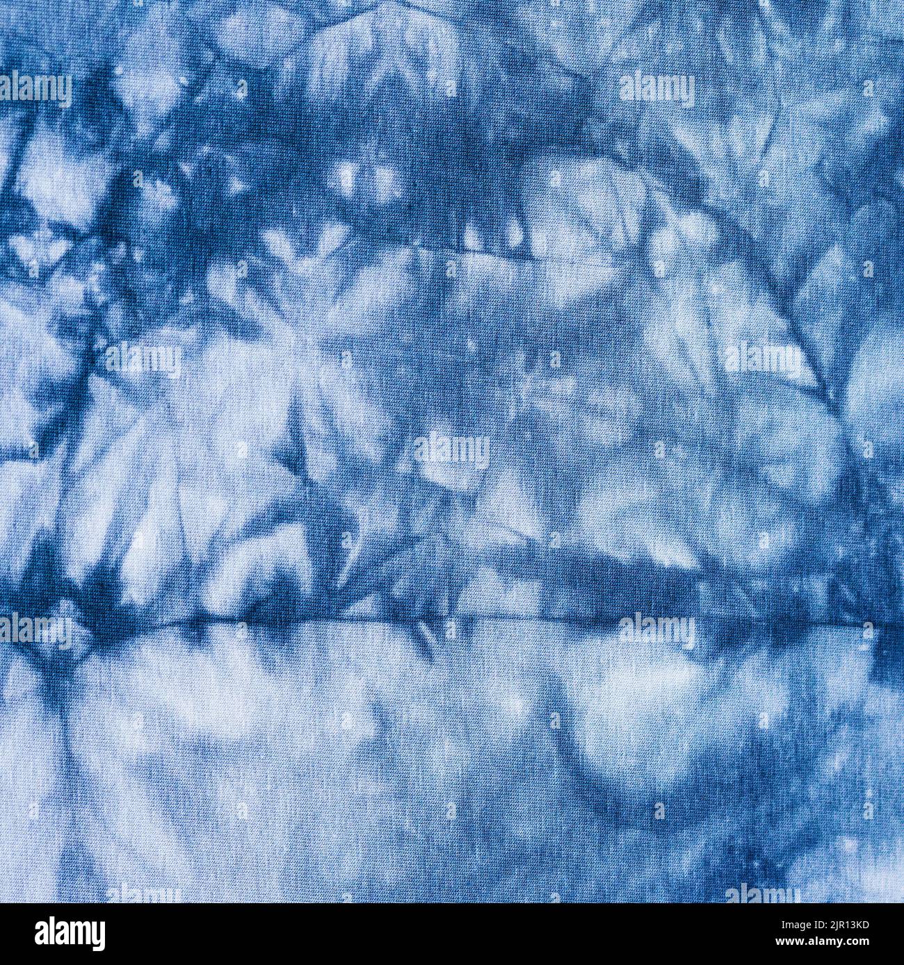 blue gray abstract pattern handcrafted in tie dye technique on cotton jersey fabric Stock Photo