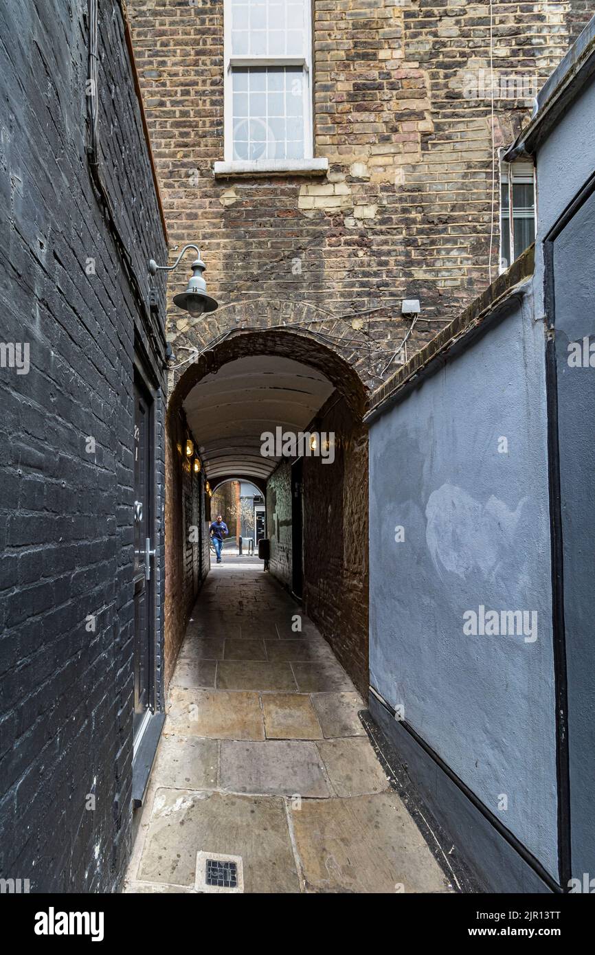 Dating from 1746, Newman Passage is a narrow cobbled lane linking Newman Street with Rathbone Street in Fitzrovia, London W1 Stock Photo