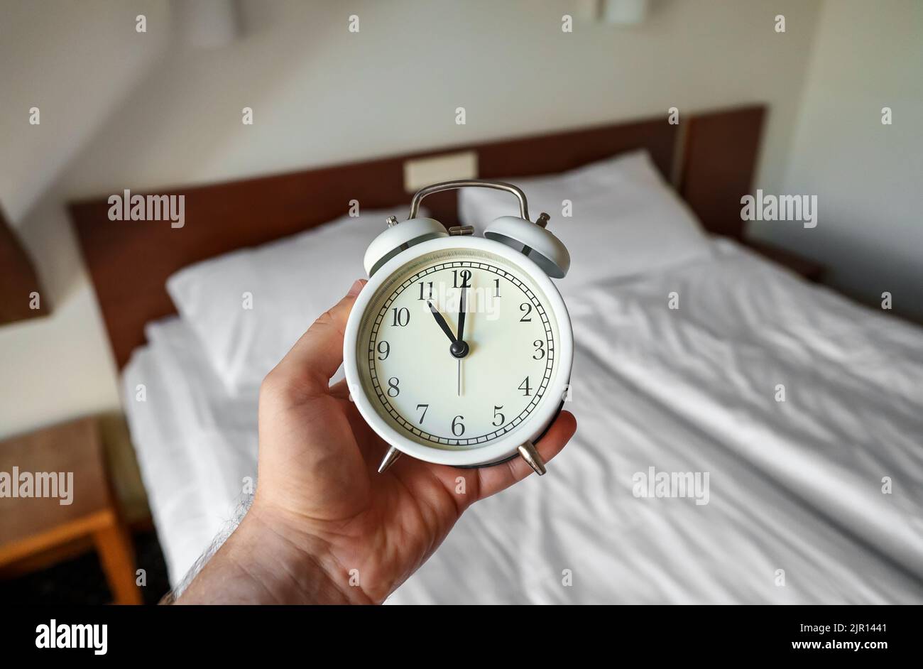 The clock shows 11 am. Time to get up Stock Photo Alamy