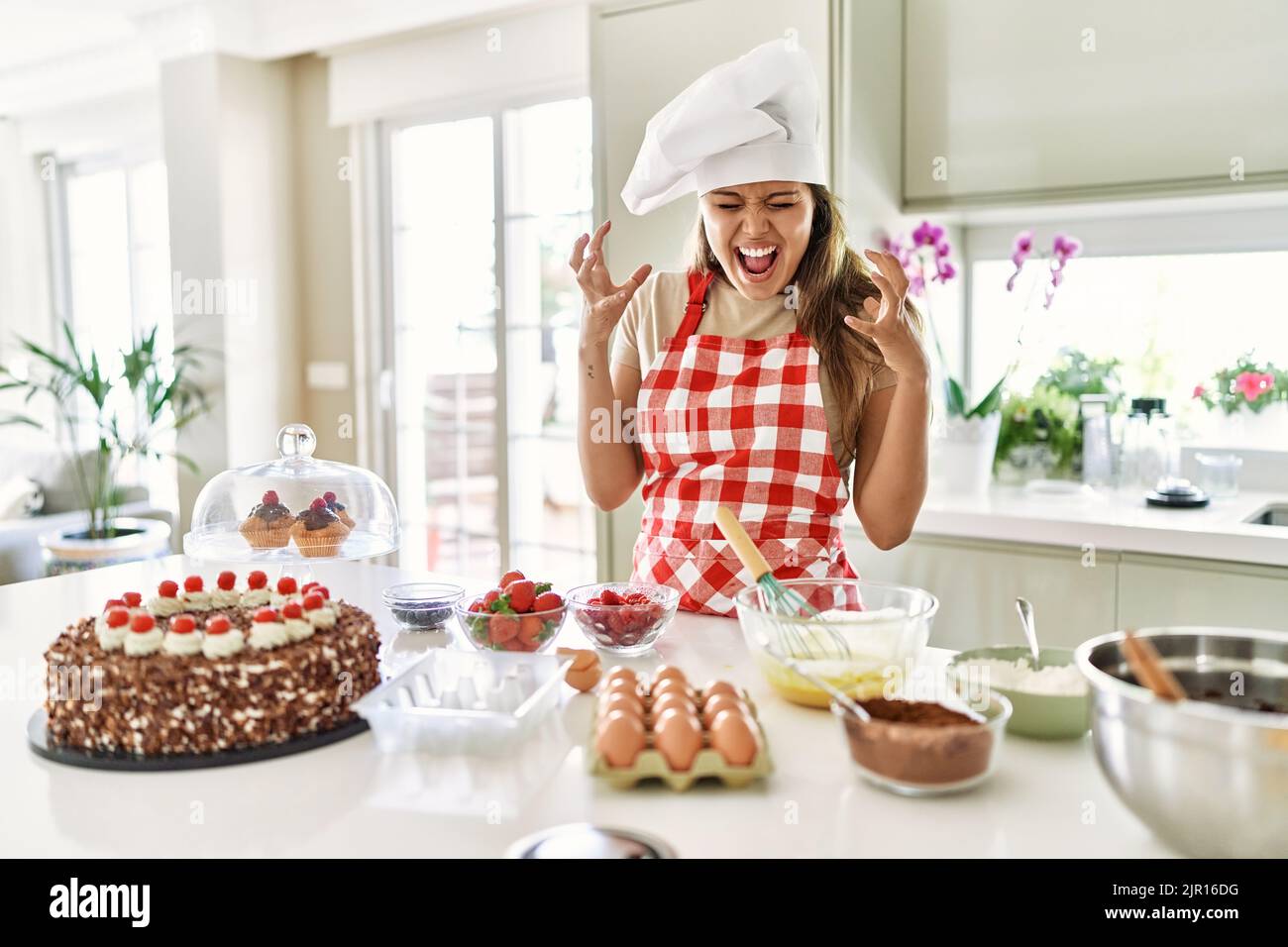 Beautiful Young Brunette Pastry Chef Woman Cooking Pastries At The Kitchen Celebrating Mad And 