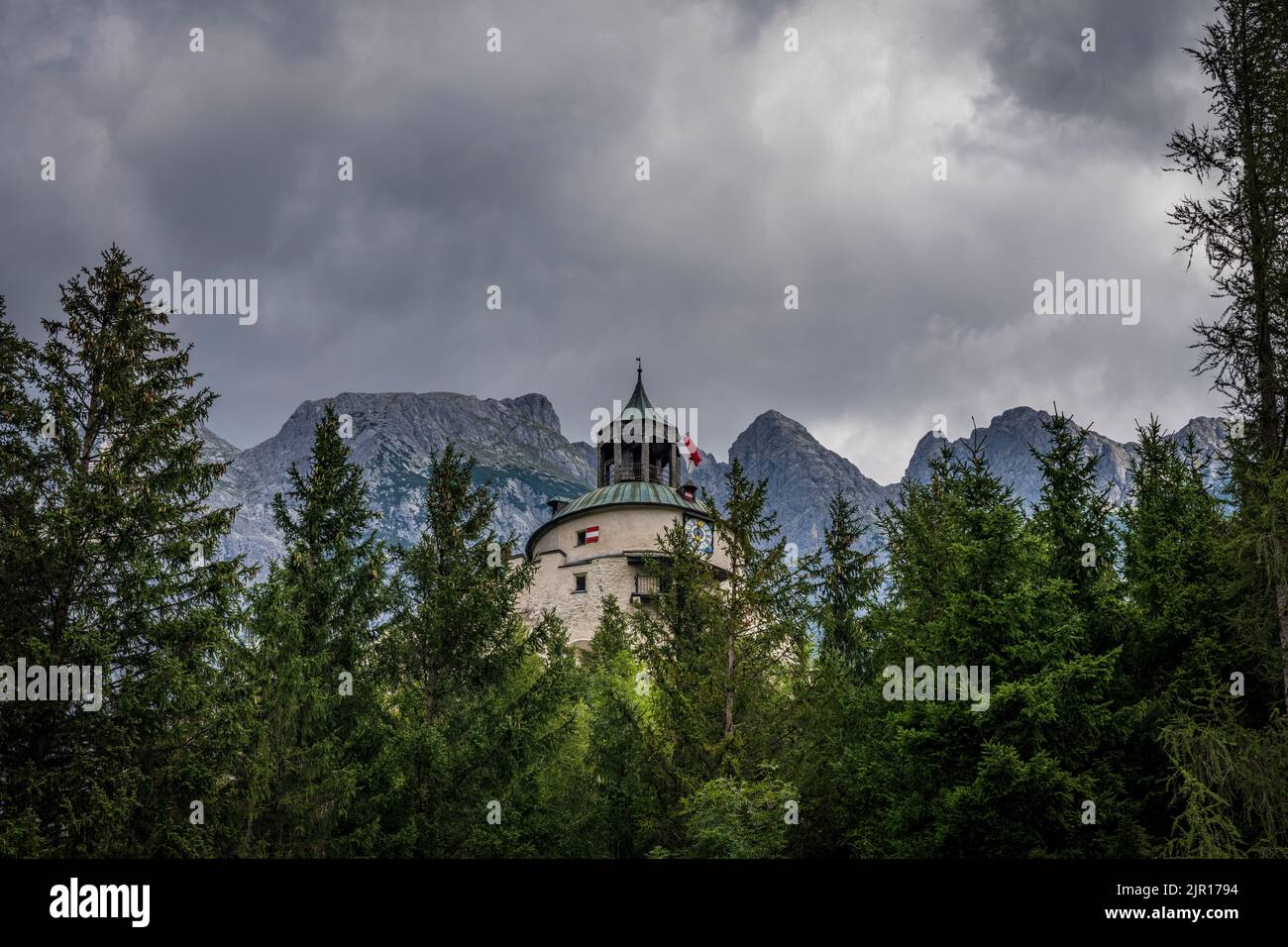 Hohenwerfen castle rises above the trees, near Werfen, Austria Stock Photo