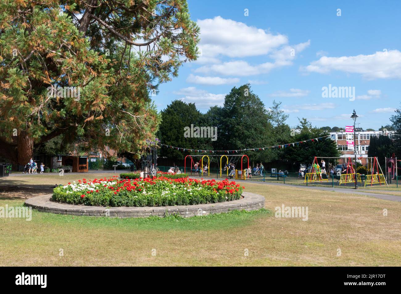 Alton Public Gardens, a park in the Hampshire market town, England, UK, busy with people on a summer day Stock Photo