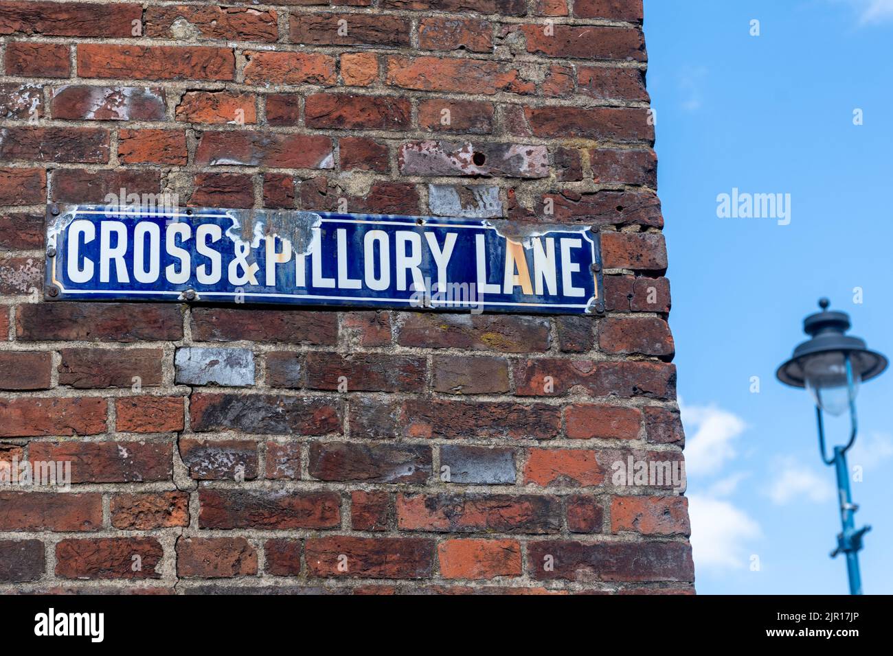 Cross & Pillory Lane, unusual road sign with name associated with historic form of punishment Stock Photo