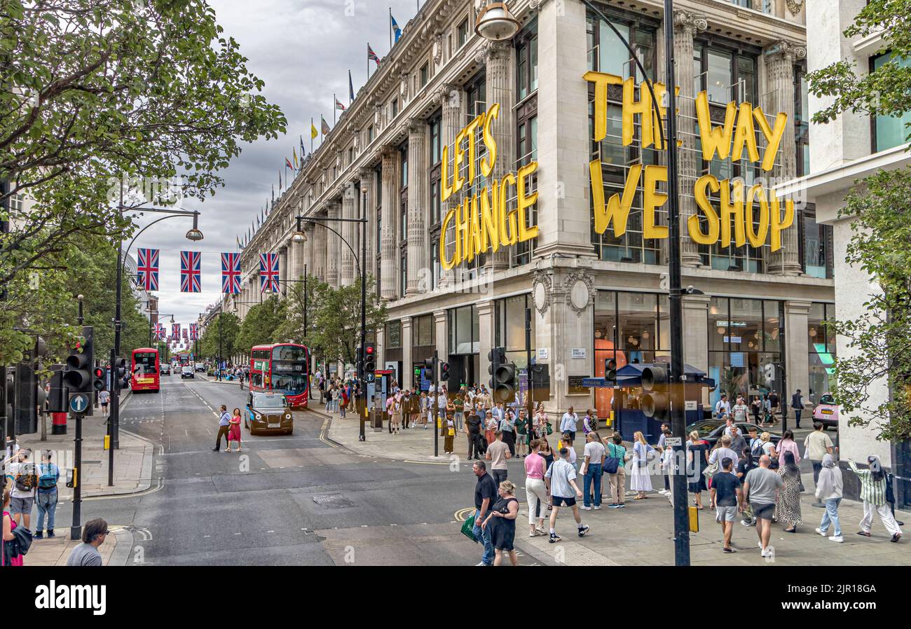 'Let's change the way we shop sign' on the side of Selfridge's department store, part of Project Earth, a sustainability strategy, Oxford St, London Stock Photo