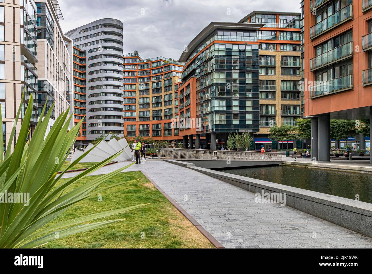 Paddington Basin, a long canal basin, surrounded by apartments , offices and restaurants overlooking the Grand Union Canal , Paddington ,London Stock Photo