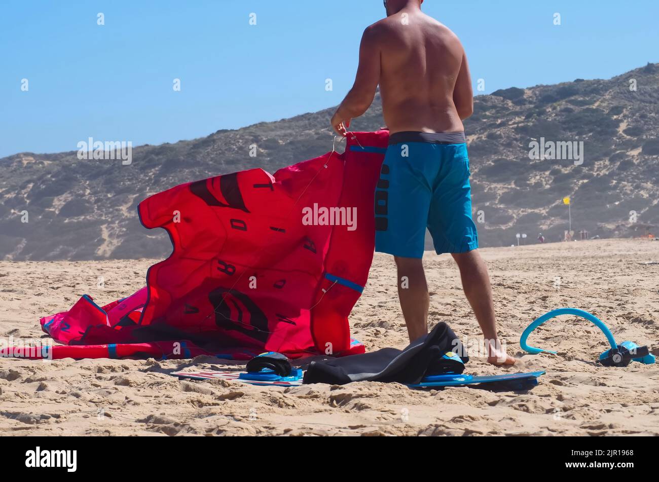 North kiteboarding kite surfing umbrella in red at the beach Stock