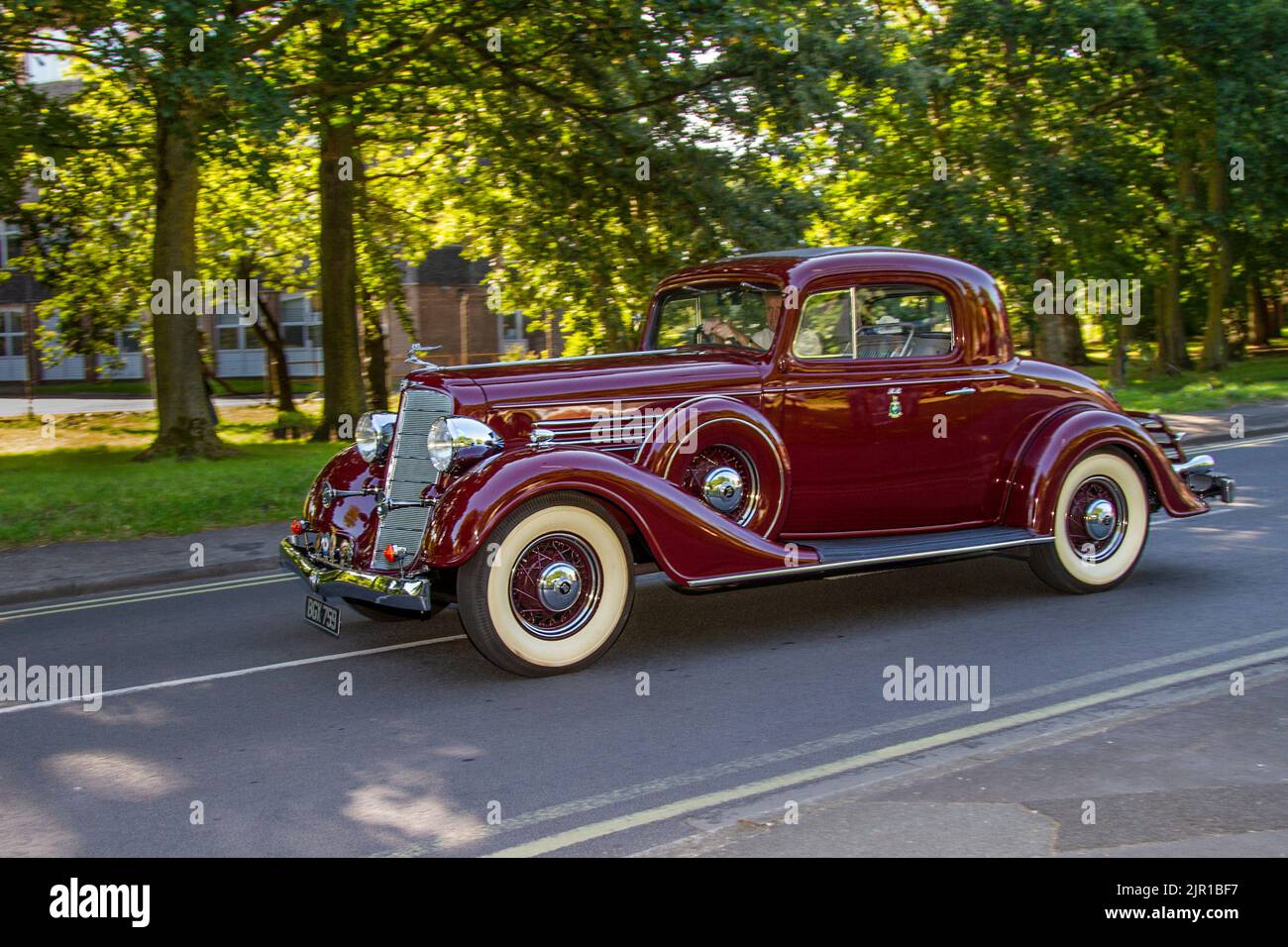 1934, 30s thirties, pre-war Maroon American BUICK Coupe 3900c petrol USA limousine; Vintage motors, and cars on display at the 13th Lytham Hall Summer Classic Car & Show, a Classic Vintage Collectible Transport Festival, Blackpool, UK Stock Photo