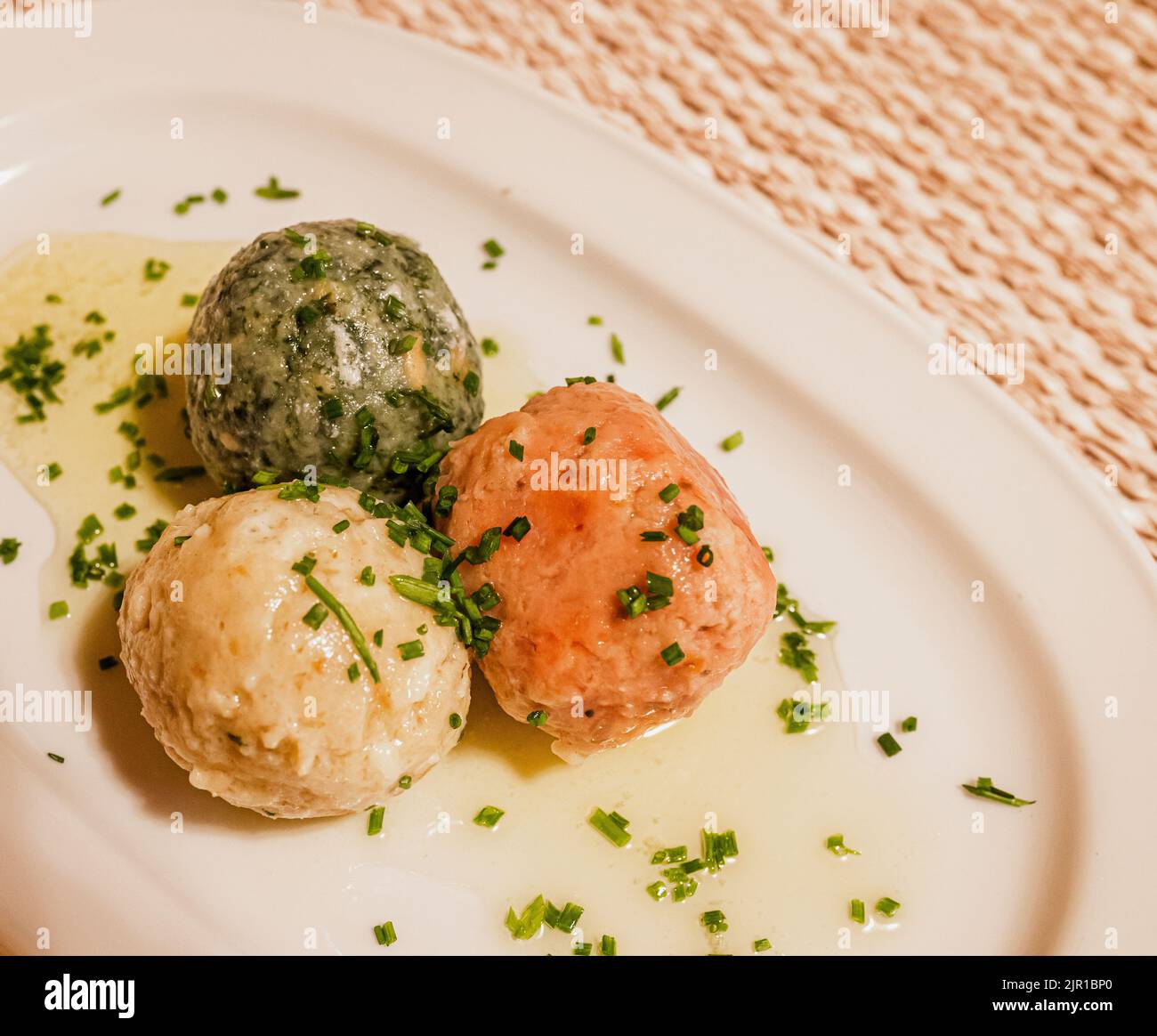 cheese dumpling, spinach dumpling and beetroot dumpling - South Tyrolean traditional food Stock Photo