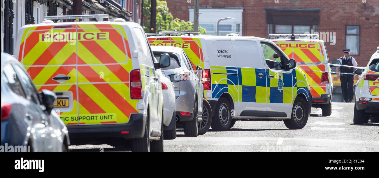 Police officers on Leinster Road in Old Swan, Liverpool, after a woman