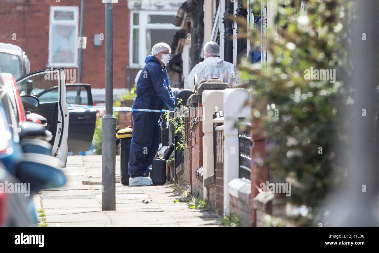 Forensic officers on Leinster Road in Old Swan, Liverpool, after a