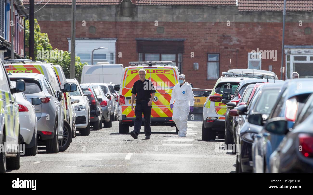 Police and forensic officers on Leinster Road in Old Swan, Liverpool