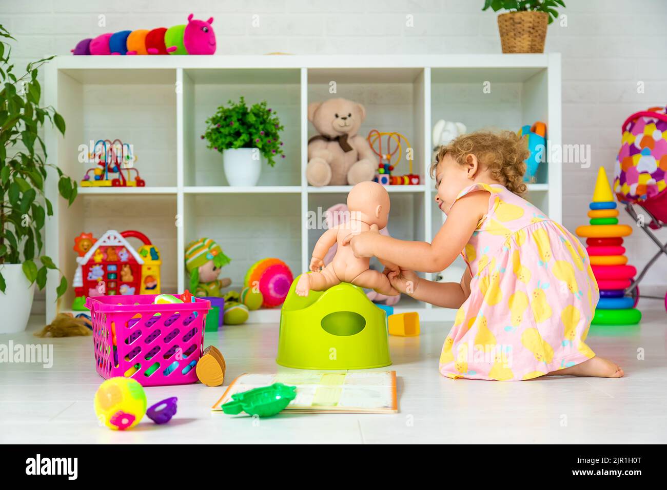 Children sit on the potty in the room. Selective focus. Kid Stock Photo