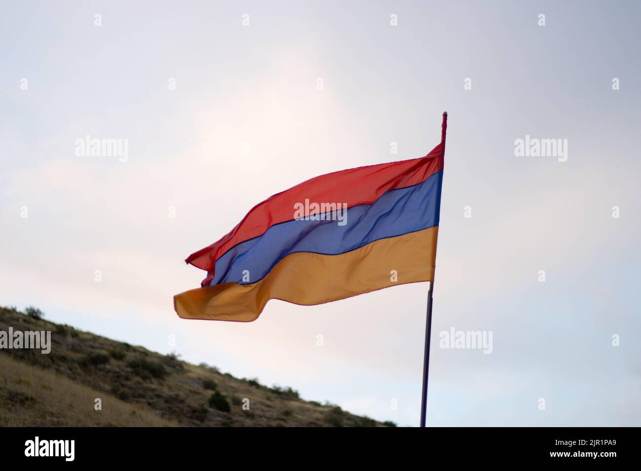 Armenian flag on blue dark sky Stock Photo - Alamy