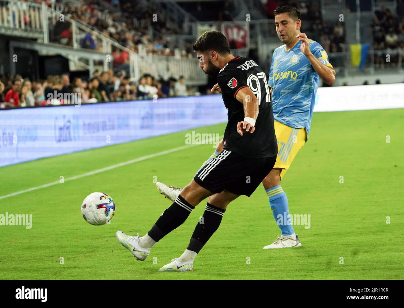 WASHINGTON, DC, USA - 20 AUGUST 2022: D.C. United defender Sami Guediri (97) boots the ball away from Philadelphia Union midfielder Alejandro Bedoya (11) during a MLS match between D.C United and the Philadelphia Union on August 20, 2022, at Audi Field, in Washington, DC. (Photo by Tony Quinn-Alamy Live News) Stock Photo