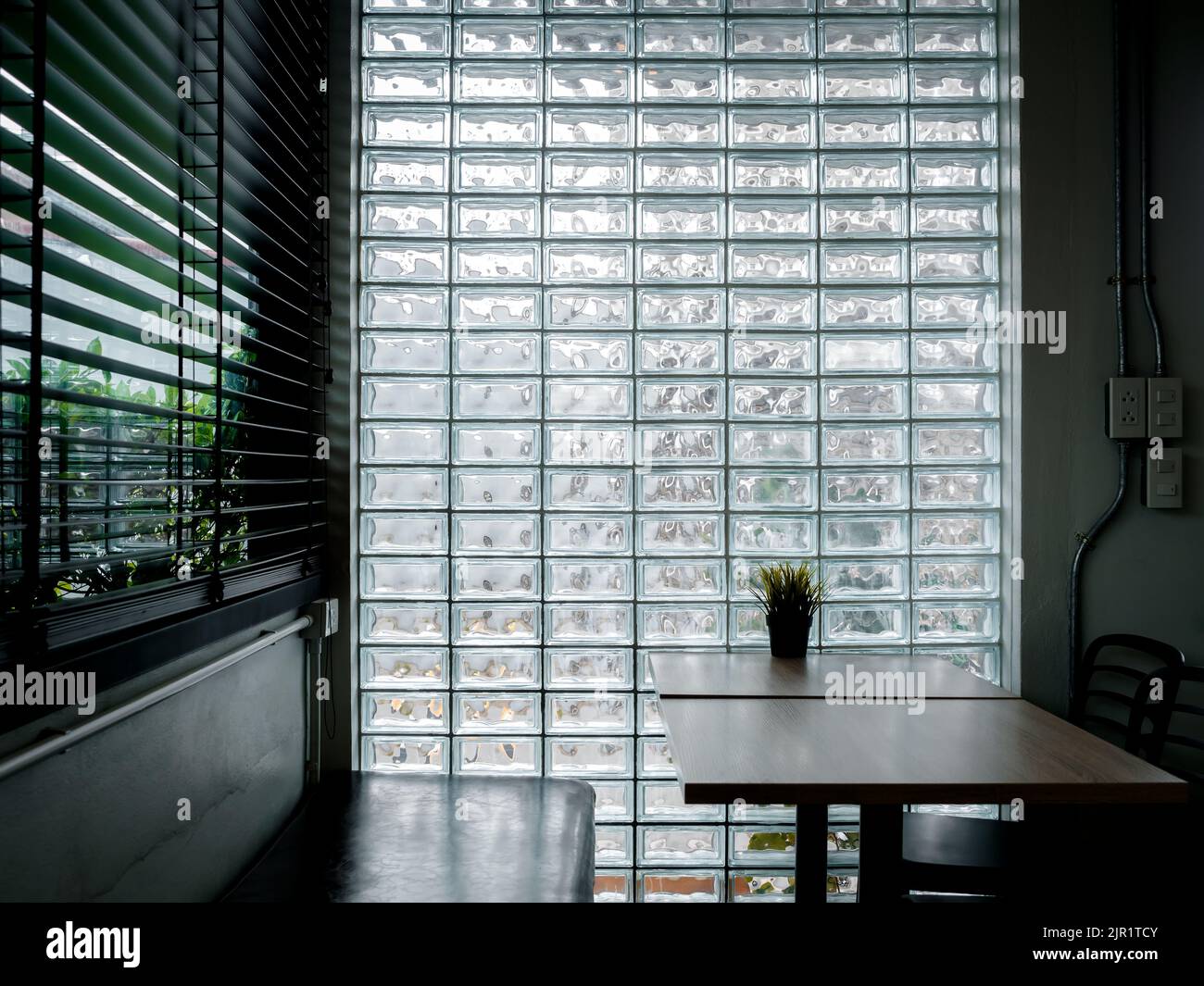 Glass brick wall background. Modern glass block wall with the light