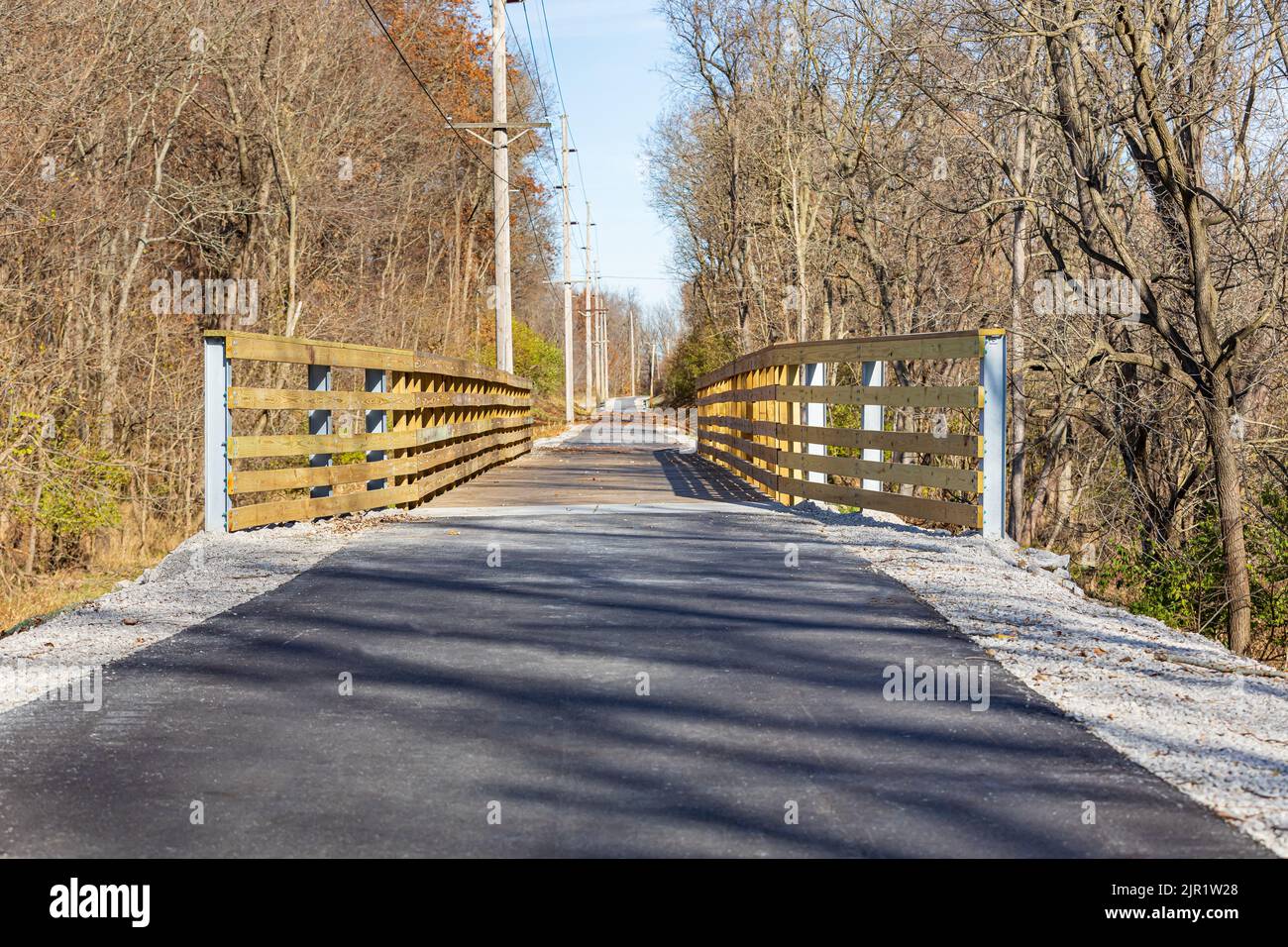 Multipurpose or multiuse bike trail in fall. Rail trail, outdoor recreation and bike path safety concept. Stock Photo
