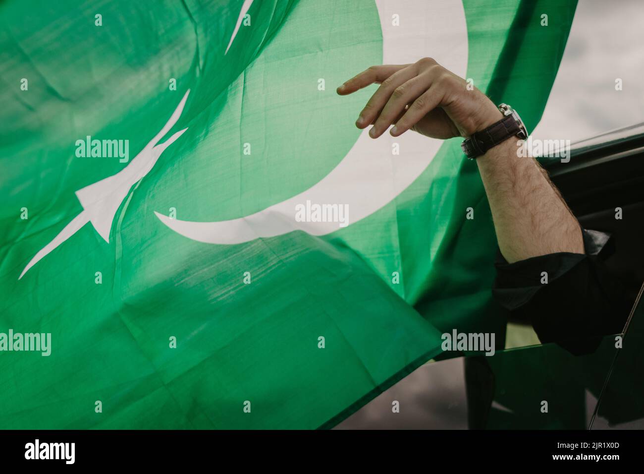 A closeup shot of the flag of Pakistan waving in the wind Stock Photo
