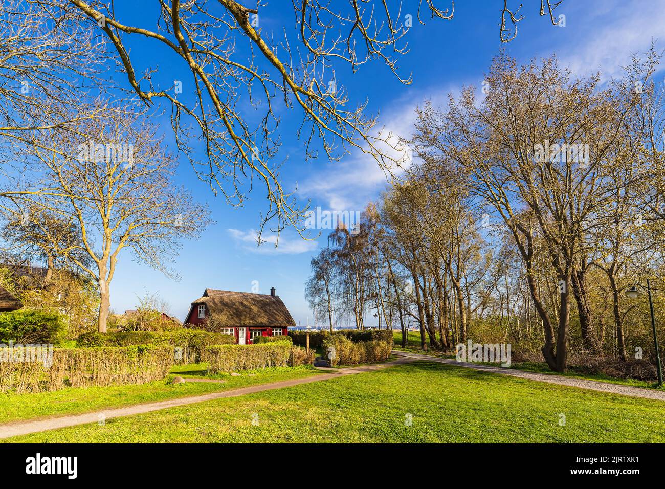 Historical building with thatched roof in Kloster on the island Hiddensee, Germany. Stock Photo