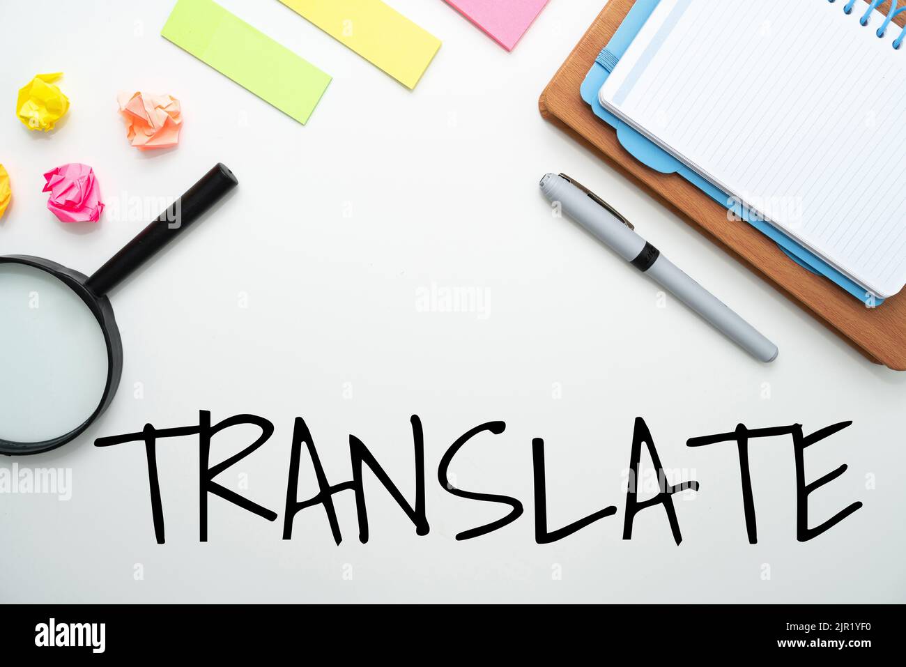 A TRANSLATE text on white background with office and school supplies