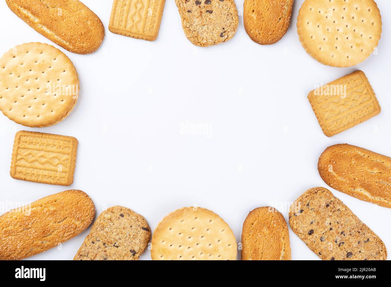 frame of different sweet baked cookies with white background. Space for advertising Stock Photo