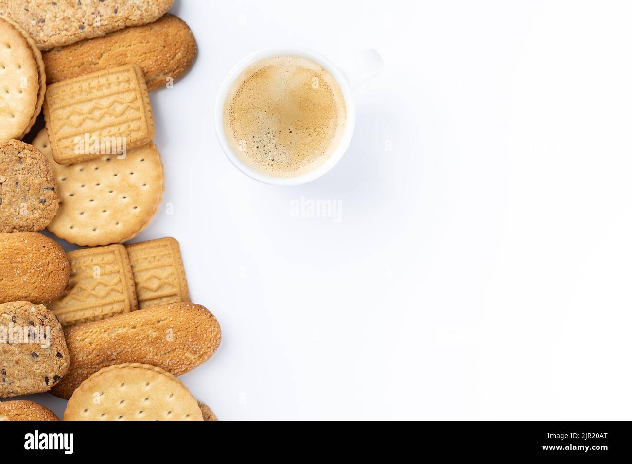 line of sweet baked cookies with a cup of coffee. Advertising space Stock Photo