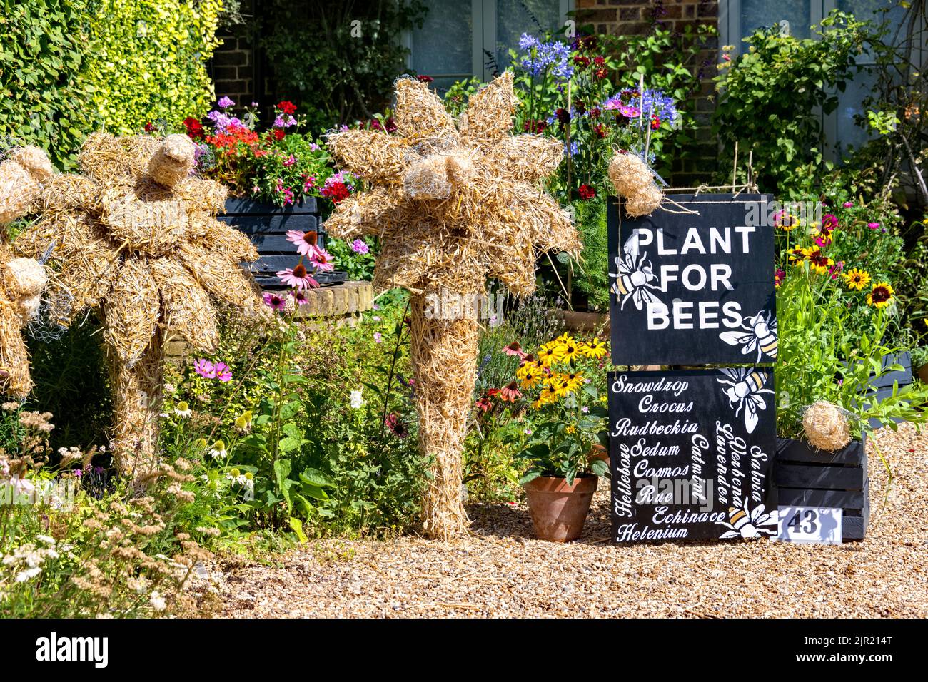 Flamstead scarecrow festival 2022, Flamstead, Herts - Plant for Bees scarecrow flowers Stock Photo