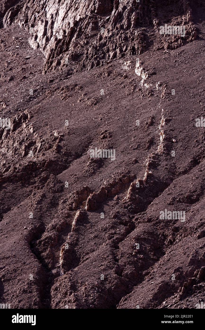 Contrasting mineral inclusions in Valle del Arcoiris or Rainbow Valley near San Pedro de Atacama, Chile. Stock Photo