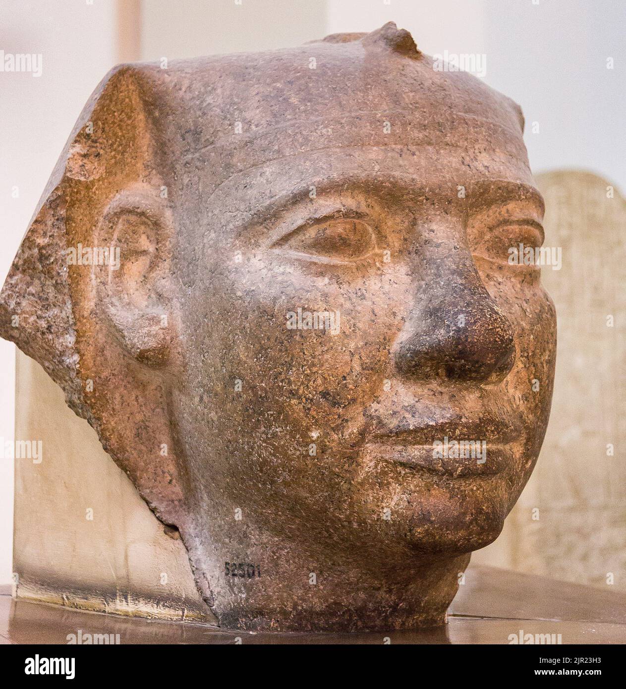 Cairo, Egyptian Museum, head of a colossal royal statue, probably of Userkaf, wearing nemes, granite. Stock Photo