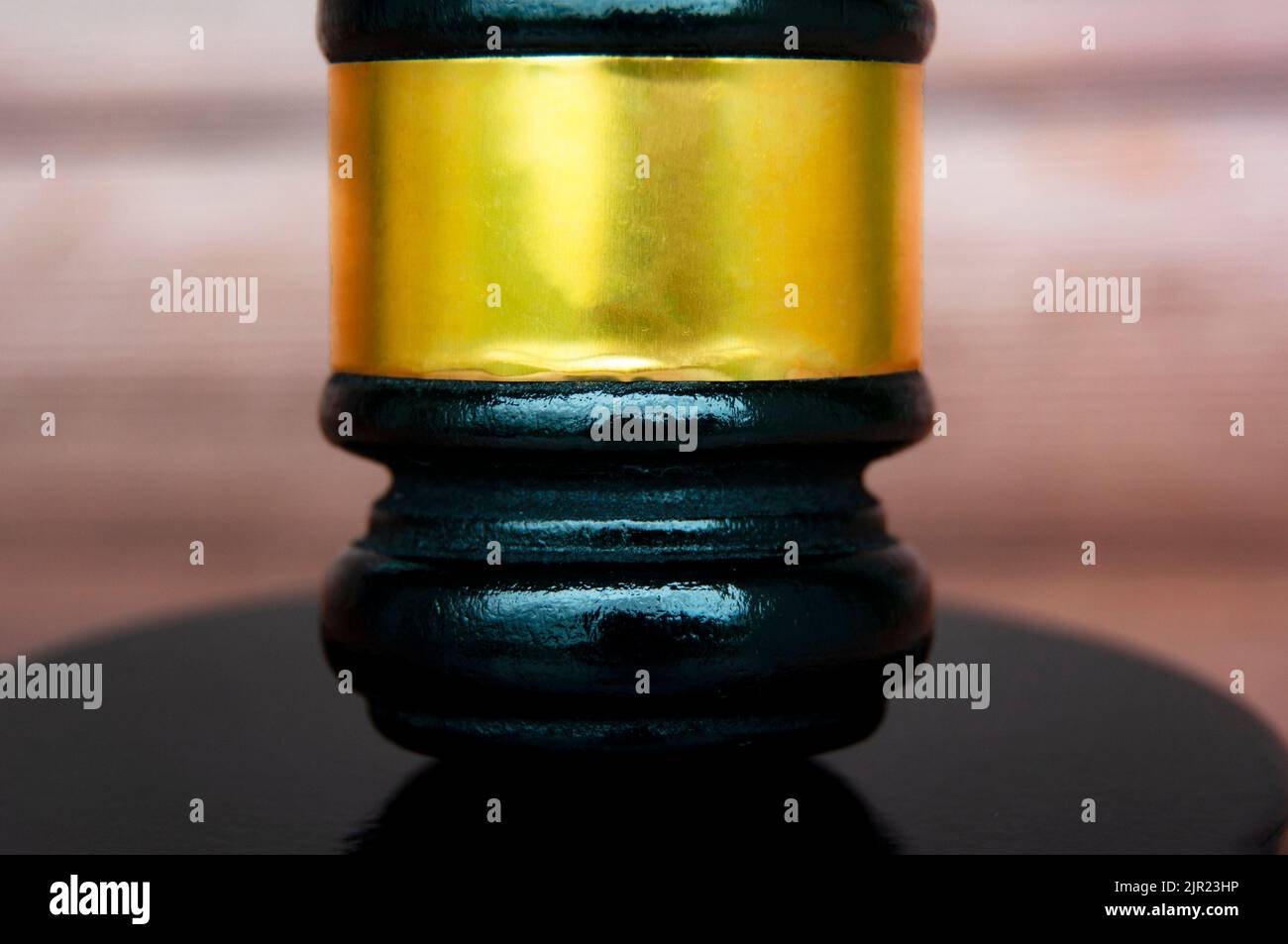 Close up of gavel with blurred wooden background. Copy space and law concept. Stock Photo